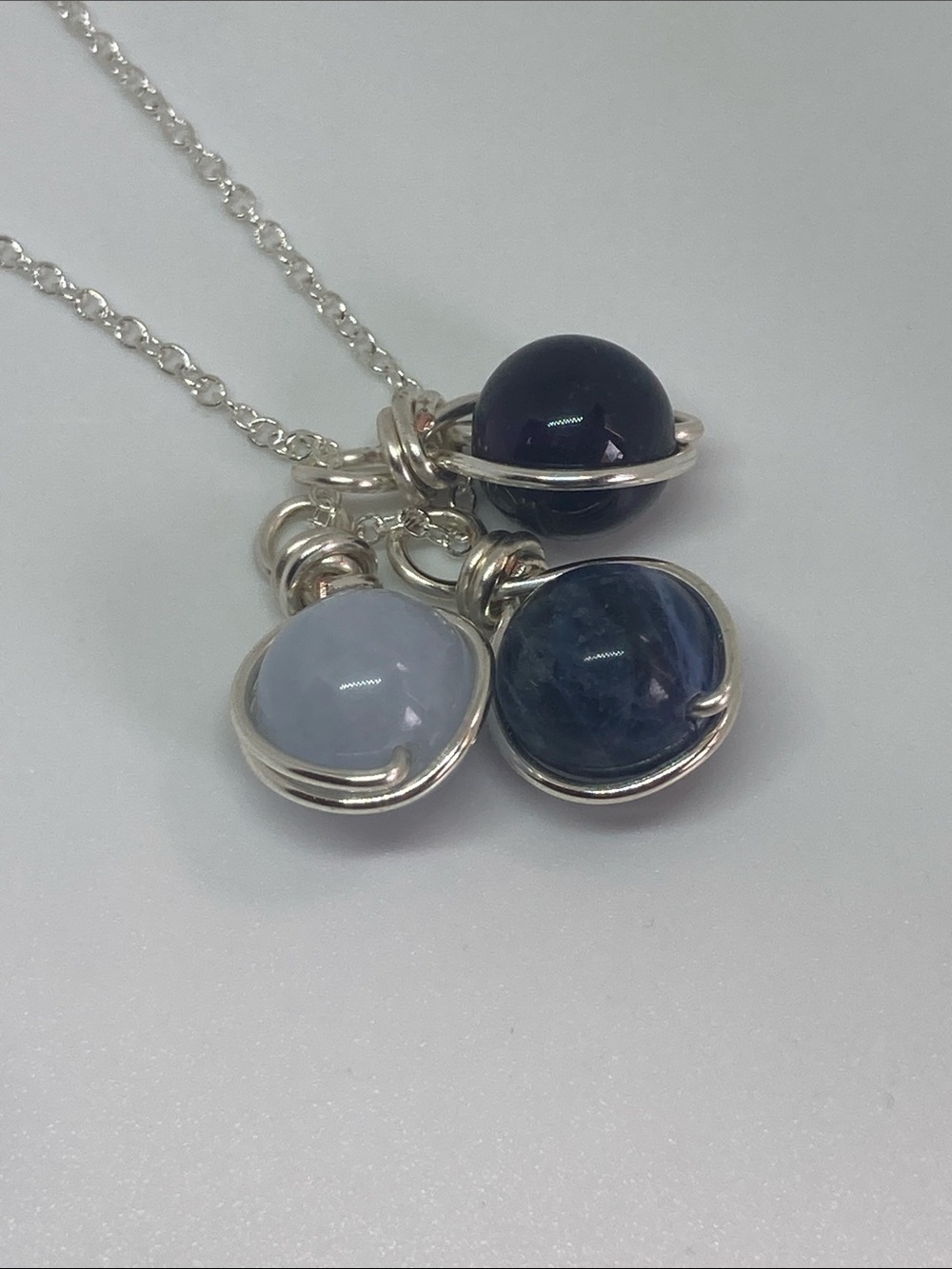 Silver necklace with amethyst, sodalite and aquamarine stone charms
